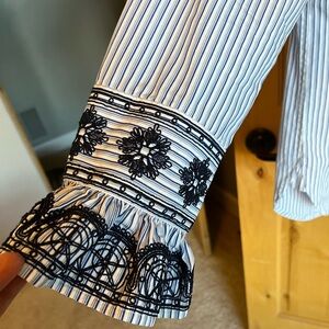 Tory Burch navy and white long sleeve blouse w embroidered details.